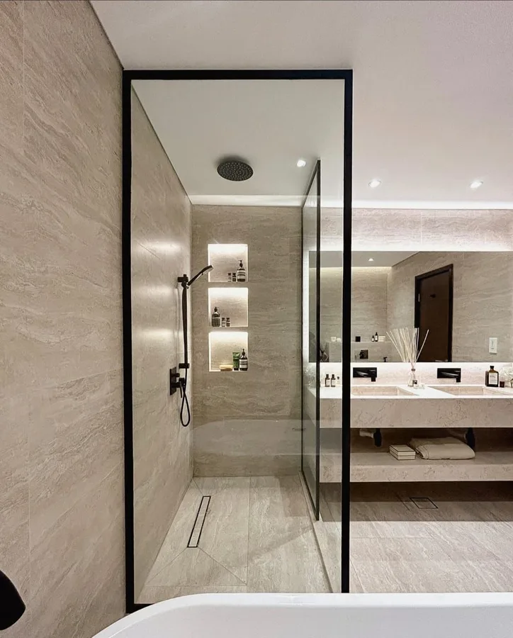 Black framed glass shower screen installed in a Dubai bathroom